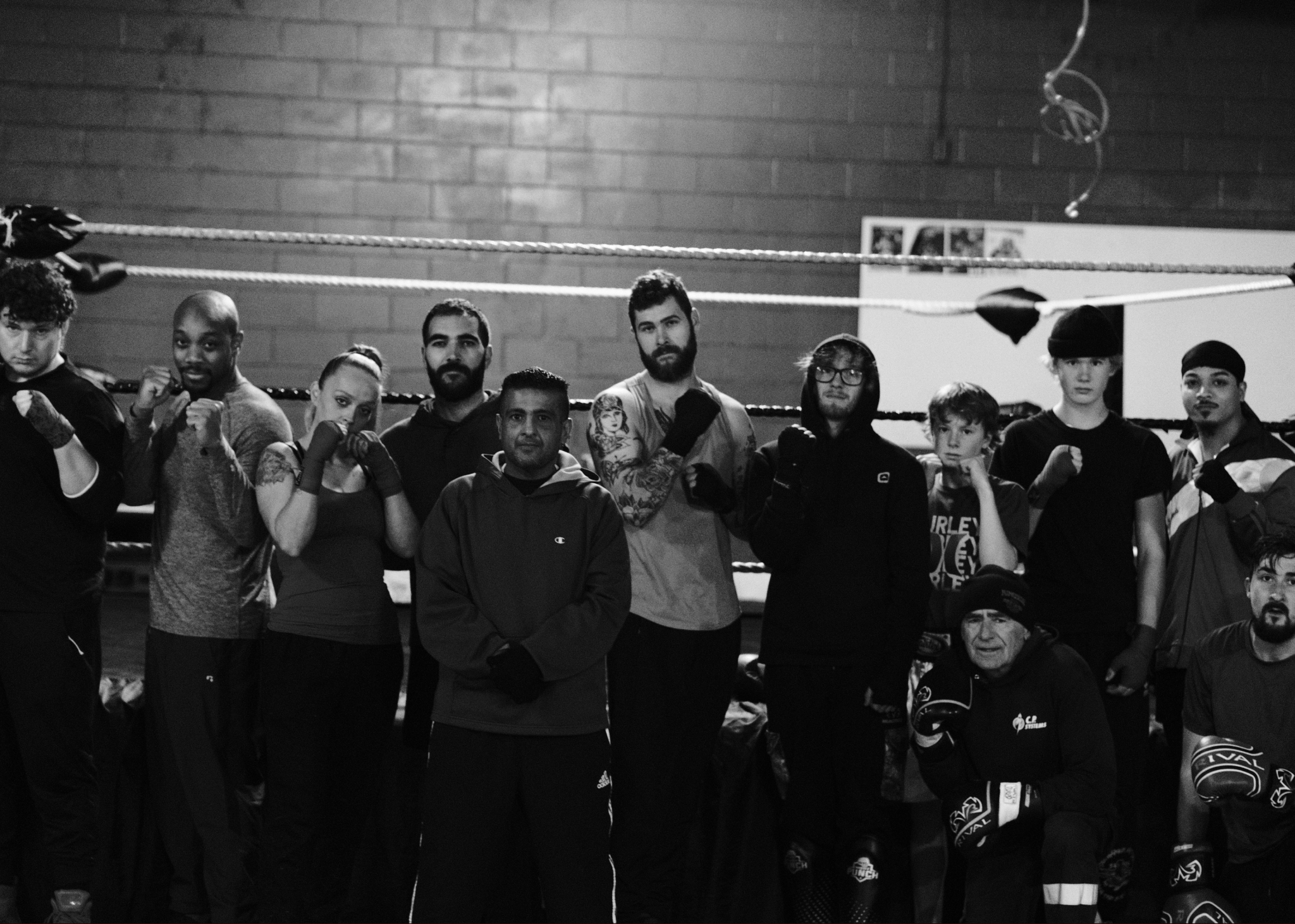 The Tiger's Den team together in front of the ring